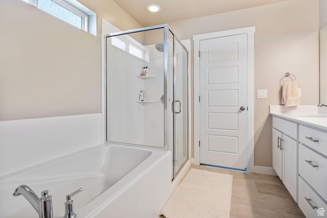 1295 E Granite Peak Rd, Eagle Mountain, UT 84005 - bathroom featuring a shower stall, a garden tub, vanity, and recessed lighting