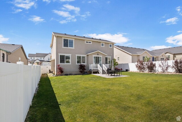 1295 E Granite Peak Rd, Eagle Mountain, UT 84005 - back of property with a patio area, stucco siding, and a residential view