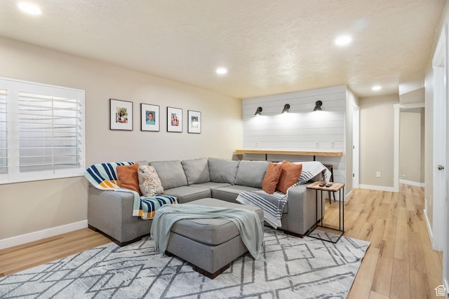1295 E Granite Peak Rd, Eagle Mountain, UT 84005 - living room with light wood-style flooring, recessed lighting, and baseboards