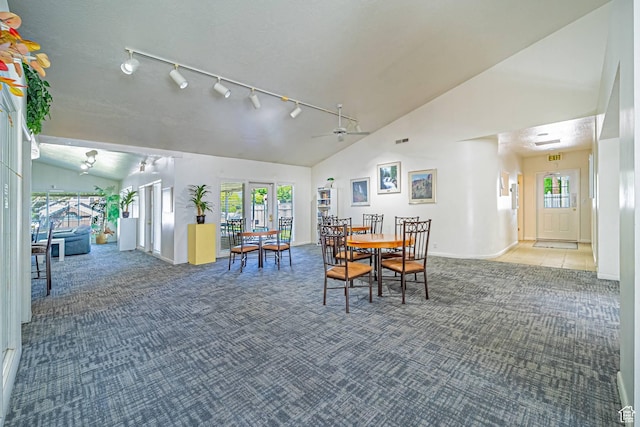 5457 S Break Water Dr W, Taylorsville, UT 84123 - dining area featuring carpet, track lighting, baseboards, high vaulted ceiling, and a ceiling fan