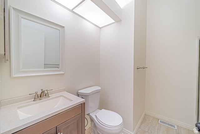 5457 S Break Water Dr W, Taylorsville, UT 84123 - bathroom with toilet, vanity, and baseboards