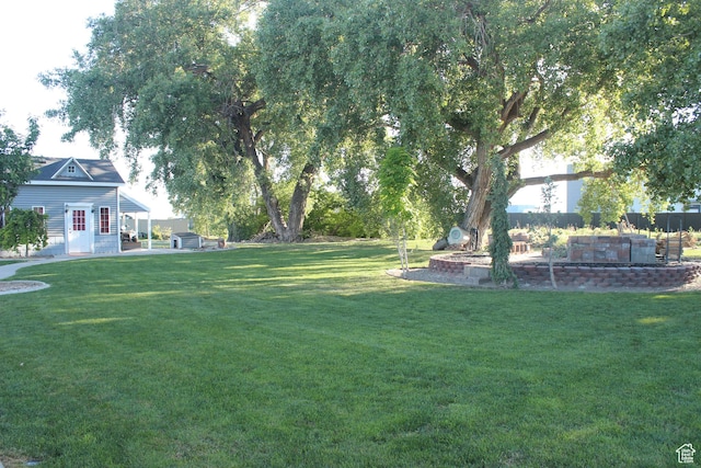 730 S 300 W, Garland, UT 84312 - view of green lawn with an outbuilding