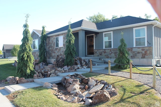 730 S 300 W, Garland, UT 84312 - ranch-style house with stone siding, board and batten siding, and a front yard
