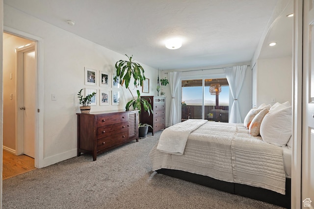 96 S 350 E, North Salt Lake, UT 84054 - bedroom featuring light carpet, access to exterior, and baseboards