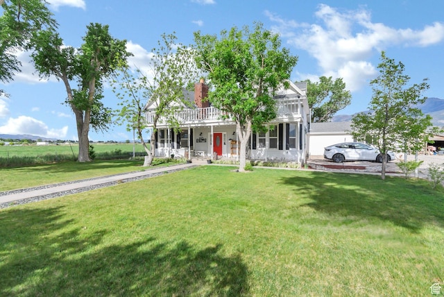 1031 S Brooklyn Rd, Elsinore, UT 84724 - greek revival house with a front yard, a porch, and a chimney