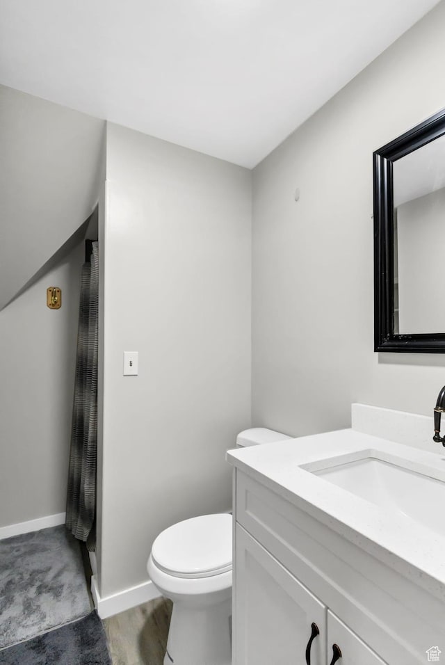 1031 S Brooklyn Rd, Elsinore, UT 84724 - bathroom with vanity, toilet, and baseboards