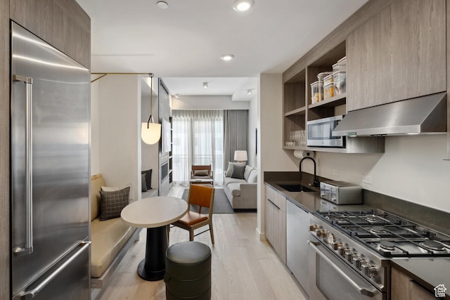 2417 W High Rd Unit 1504, Park City, UT 84098 - kitchen with high quality appliances, range hood, dark countertops, a sink, and modern cabinets