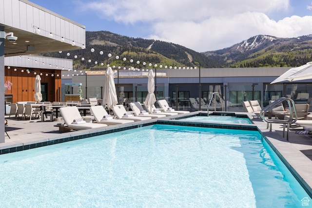2417 W High Rd Unit 1504, Park City, UT 84098 - view of pool featuring a mountain view, a patio area, and a pool with connected hot tub