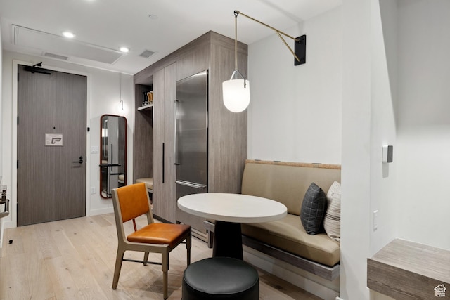 2417 W High Rd Unit 1504, Park City, UT 84098 - dining room featuring light wood finished floors, recessed lighting, and arched walkways