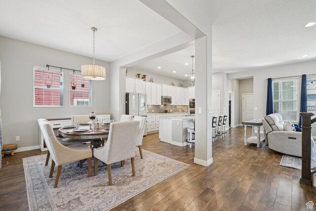4411 W S Jordan Pkwy, South Jordan, UT 84009 - dining room featuring dark wood-type flooring, recessed lighting, and baseboards