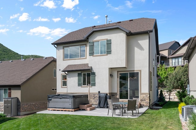 14585 S Delacroix Dr S, Draper, UT 84020 - rear view of property with a hot tub, a patio, central air condition unit, stucco siding, and stone siding