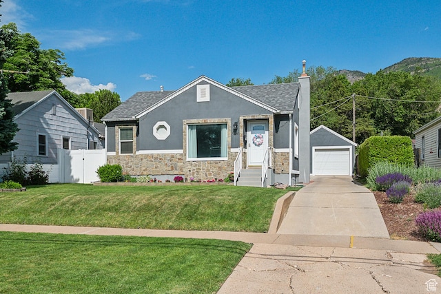 2058 Van Buren Ave, Ogden, UT 84401 - bungalow-style home with stucco siding, stone siding, a detached garage, an outdoor structure, and concrete driveway