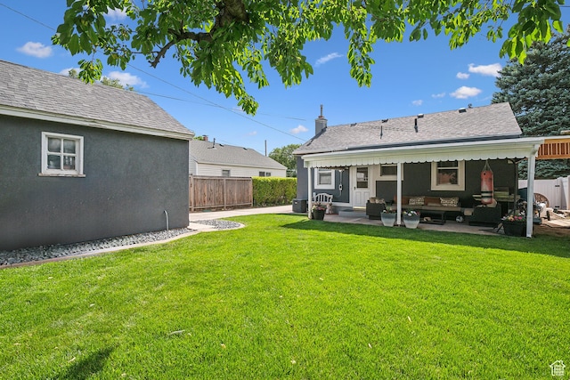 2058 Van Buren Ave, Ogden, UT 84401 - rear view of house with an outdoor hangout area, a patio area, a shingled roof, and stucco siding