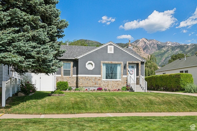 2058 Van Buren Ave, Ogden, UT 84401 - view of front facade featuring entry steps, stone siding, a mountain view, roof with shingles, and stucco siding