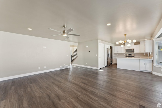 1184 S 2300 E, Spanish Fork, UT 84660 - unfurnished living room with a chandelier, stairs, baseboards, recessed lighting, and dark wood finished floors