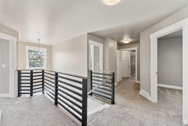 1184 S 2300 E, Spanish Fork, UT 84660 - hall featuring an upstairs landing, carpet flooring, a chandelier, and baseboards