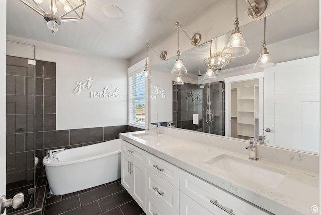 1184 S 2300 E, Spanish Fork, UT 84660 - full bath with tile patterned flooring, a freestanding tub, double vanity, a shower stall, and tile walls