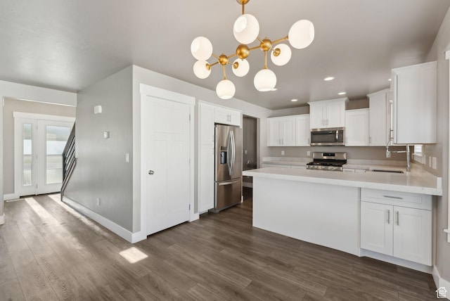1184 S 2300 E, Spanish Fork, UT 84660 - kitchen featuring stainless steel appliances, a sink, light countertops, dark wood-style floors, and recessed lighting
