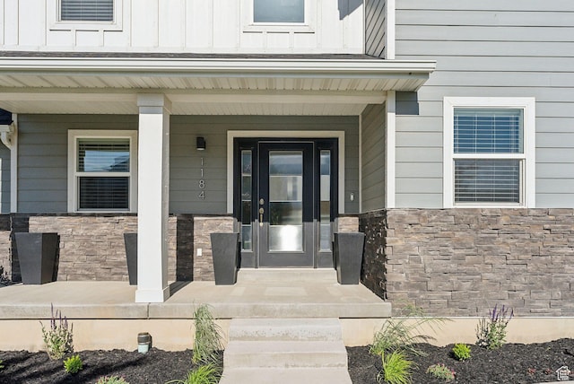 1184 S 2300 E, Spanish Fork, UT 84660 - property entrance with stone siding, a porch, and board and batten siding