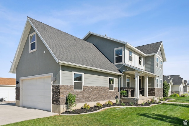 1184 S 2300 E, Spanish Fork, UT 84660 - view of front facade featuring stone siding, a garage, a front yard, a shingled roof, and concrete driveway