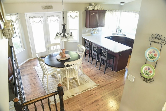 14114 S 3600 W, Bluffdale, UT 84065 - dining room with healthy amount of natural light, light wood-style floors, and baseboards
