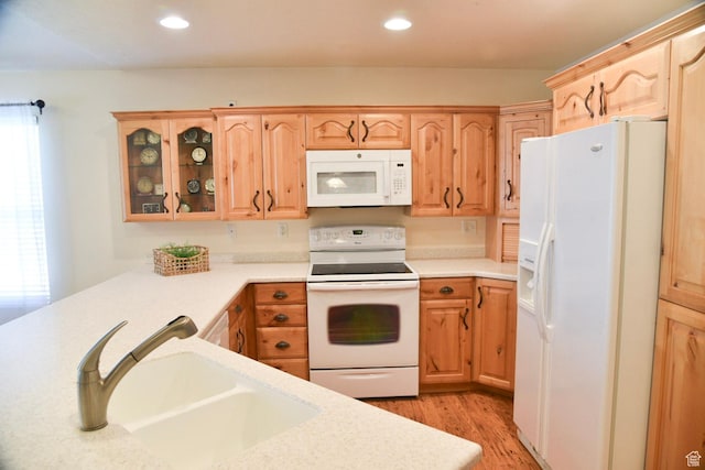 14114 S 3600 W, Bluffdale, UT 84065 - kitchen featuring white appliances, a sink, light countertops, light wood finished floors, and glass insert cabinets
