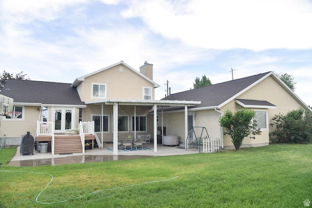 14114 S 3600 W, Bluffdale, UT 84065 - rear view of house with a patio area, a deck, a chimney, a yard, and stucco siding