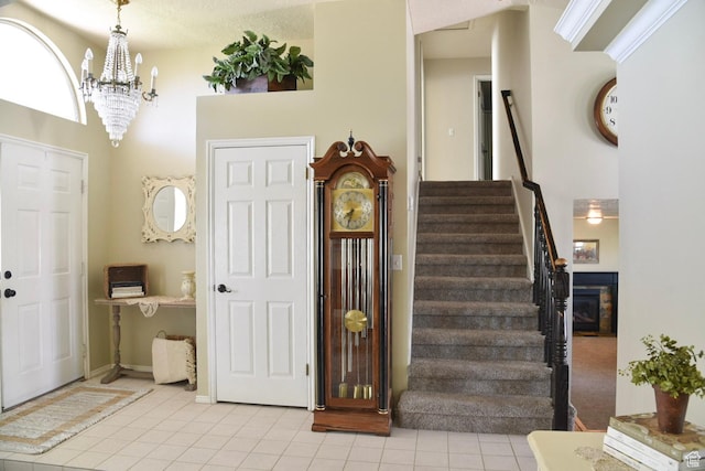 14114 S 3600 W, Bluffdale, UT 84065 - foyer featuring light tile patterned floors, stairs, and a chandelier