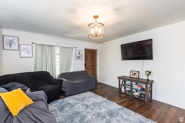 824 N 200 E, Price, UT 84501 - living area featuring wood finished floors, baseboards, and a chandelier