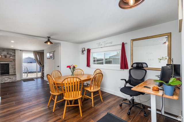 824 N 200 E, Price, UT 84501 - dining space featuring wood finished floors, an office area, baseboards, and a fireplace