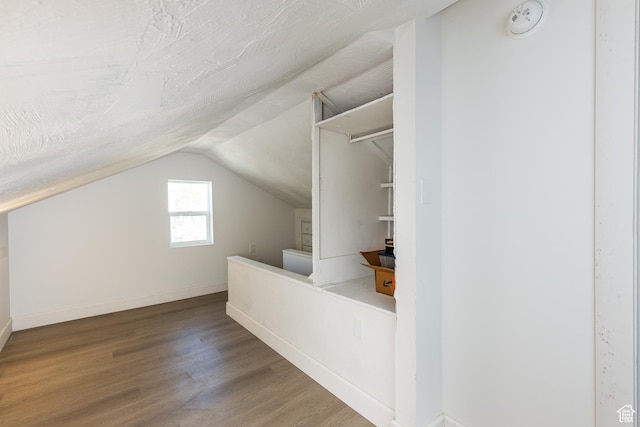 824 N 200 E, Price, UT 84501 - additional living space with wood finished floors, lofted ceiling, and baseboards