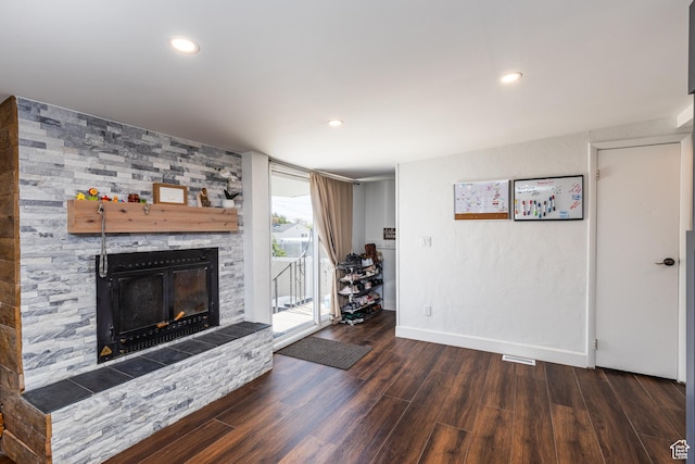 824 N 200 E, Price, UT 84501 - living area featuring wood finished floors, a fireplace, baseboards, and recessed lighting
