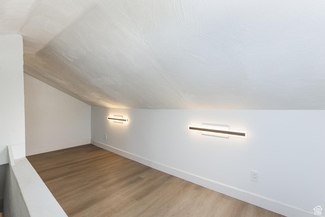 824 N 200 E, Price, UT 84501 - additional living space with vaulted ceiling, wood finished floors, and baseboards