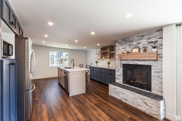 824 N 200 E, Price, UT 84501 - kitchen with a sink, appliances with stainless steel finishes, baseboards, recessed lighting, and dark wood finished floors