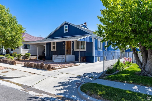 824 N 200 E, Price, UT 84501 - view of front facade featuring a porch, concrete driveway, and board and batten siding