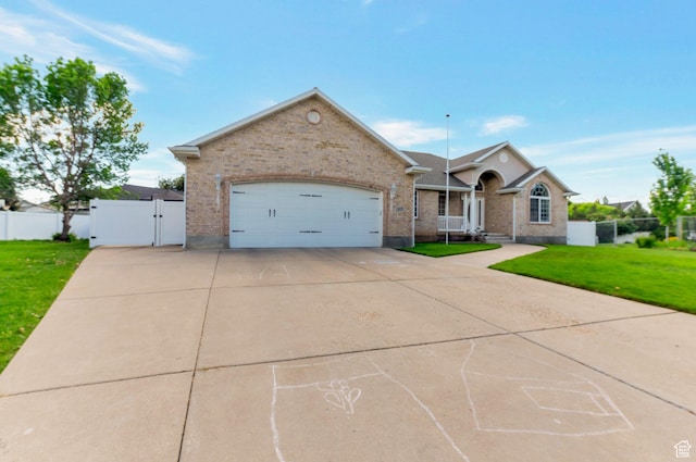 625 W Derrick Cir W, Morgan, UT 84050 - ranch-style house featuring a gate, brick siding, driveway, and a garage