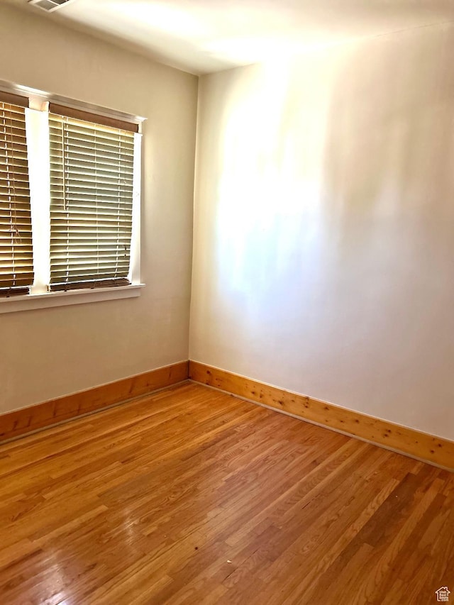 734 S 1300 E, Salt Lake City, UT 84102 - spare room featuring baseboards and wood finished floors