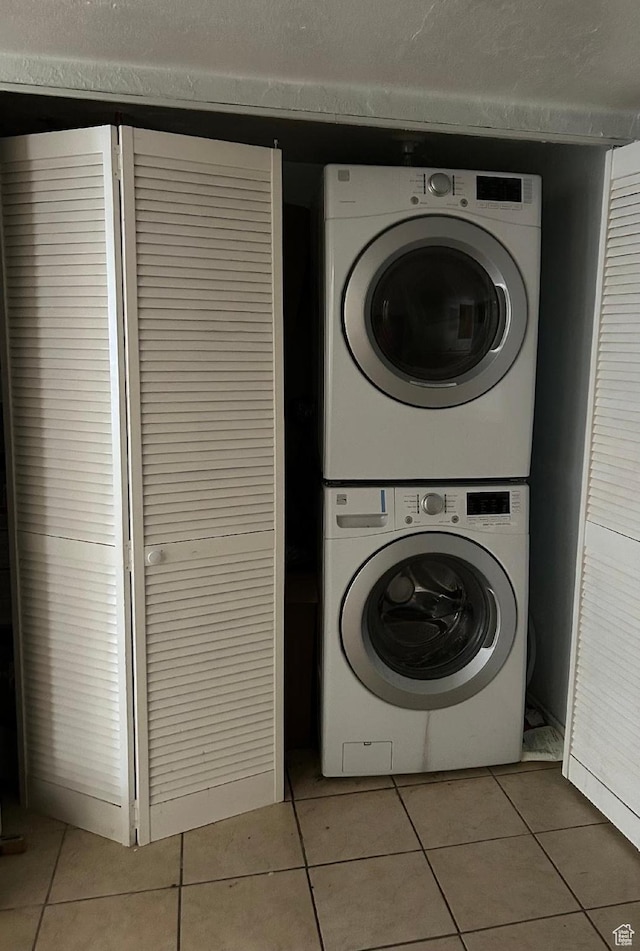 734 S 1300 E, Salt Lake City, UT 84102 - washroom with stacked washing machine and dryer and light tile patterned floors