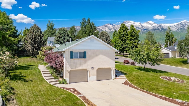 543 Hillside Cir, Alpine, UT 84004 - view of side of home featuring driveway, an attached garage, a yard, a mountain view, and stairway