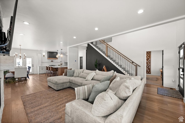 4681 W 75 N, West Point, UT 84015 - living area with a chandelier, light wood-style floors, stairway, and recessed lighting