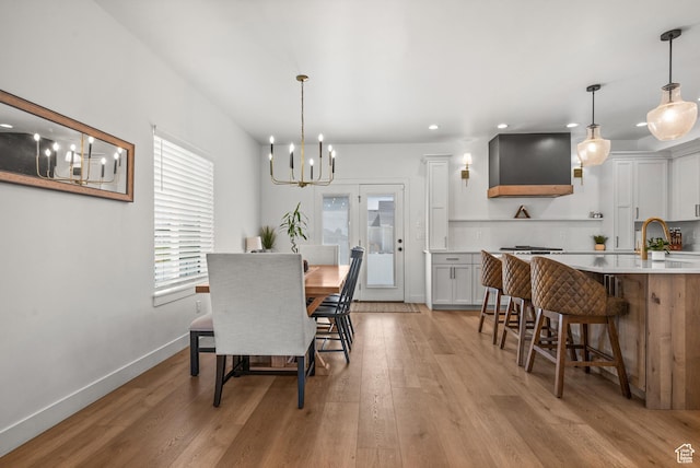 4681 W 75 N, West Point, UT 84015 - dining room featuring a chandelier, recessed lighting, light wood-style floors, and baseboards