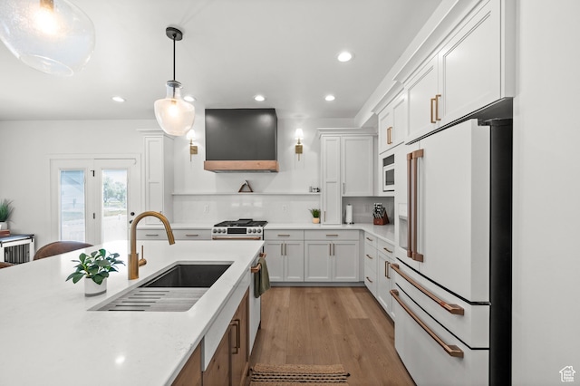 4681 W 75 N, West Point, UT 84015 - kitchen with white appliances, a sink, wall chimney exhaust hood, recessed lighting, and white cabinetry