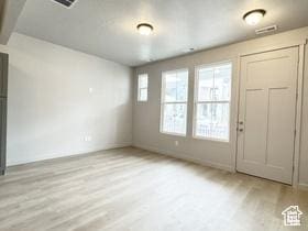 11197 S Rummy Way S, South Jordan, UT 84009 - entryway with light wood-style flooring and baseboards