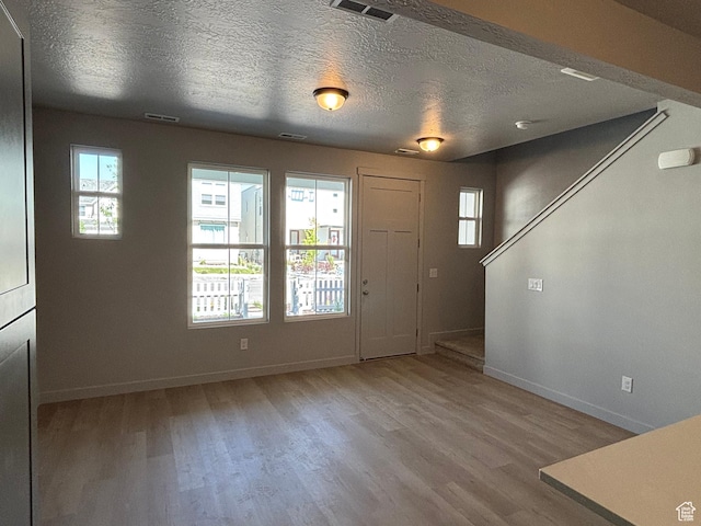 11197 S Rummy Way S, South Jordan, UT 84009 - entryway with baseboards, wood finished floors, and a textured ceiling