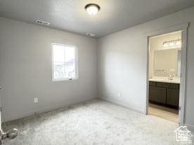 11197 S Rummy Way S, South Jordan, UT 84009 - unfurnished bedroom featuring connected bathroom and baseboards