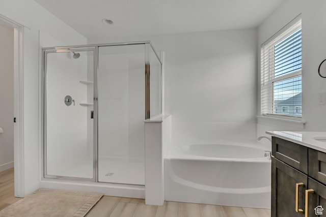 4214 E Sun Crest Dr Unit Lot68, Eagle Mountain, UT 84005 - bathroom with a shower stall, a garden tub, vanity, and wood finished floors