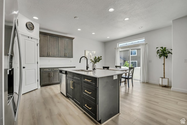 4214 E Sun Crest Dr Unit Lot68, Eagle Mountain, UT 84005 - kitchen with a sink, stainless steel appliances, a textured ceiling, light wood-style floors, and recessed lighting