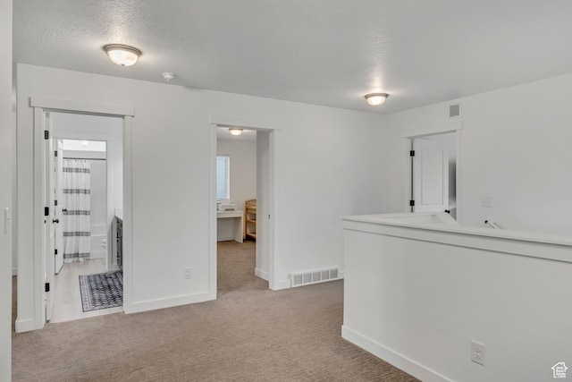 4214 E Sun Crest Dr Unit Lot68, Eagle Mountain, UT 84005 - empty room with light carpet, baseboards, a textured ceiling, and a smoke detector
