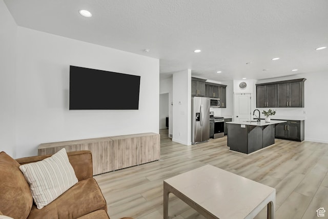 4214 E Sun Crest Dr Unit Lot68, Eagle Mountain, UT 84005 - living area featuring light wood-style floors, recessed lighting, and baseboards