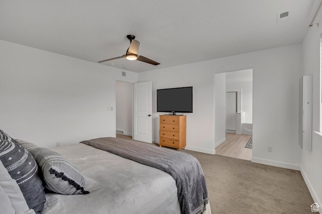 4214 E Sun Crest Dr Unit Lot68, Eagle Mountain, UT 84005 - bedroom featuring light colored carpet, a ceiling fan, baseboards, and ensuite bath